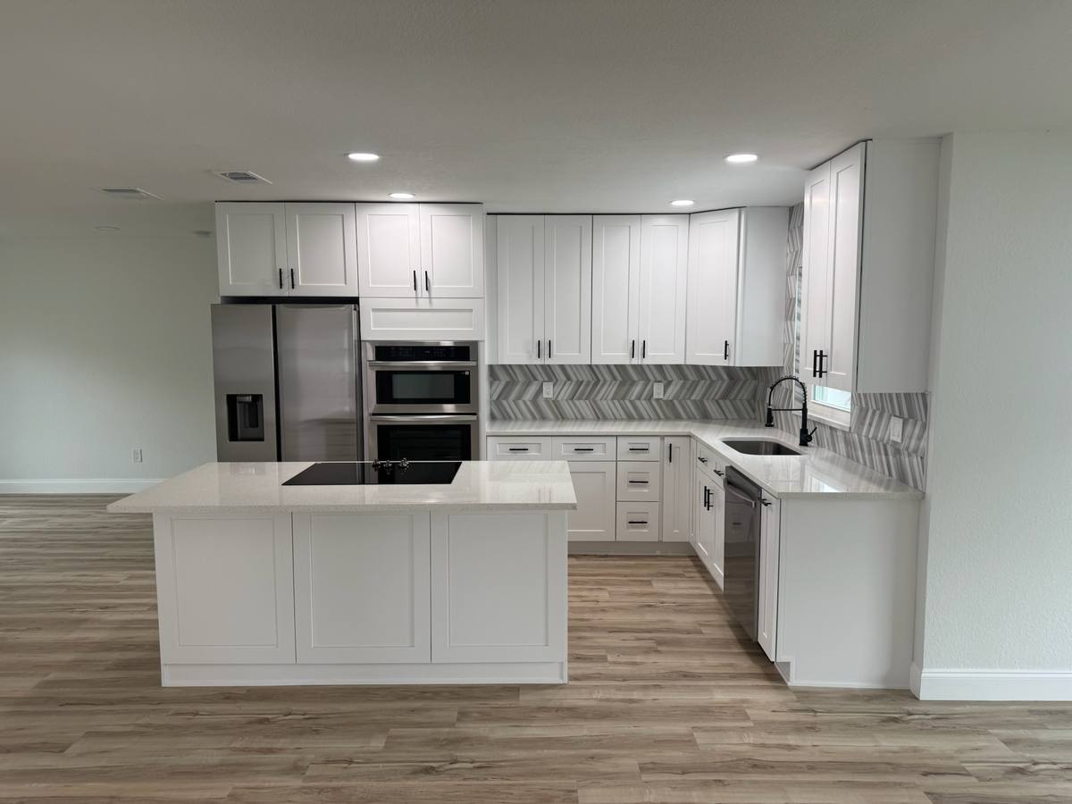 Bradenton kitchen — White Shaker cabinets with chevron tile backsplash