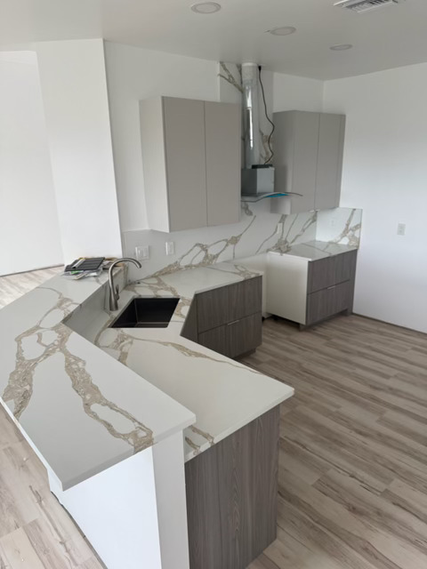 Rotonda West kitchen — Upper cabinets and Calacatta quartz countertops
